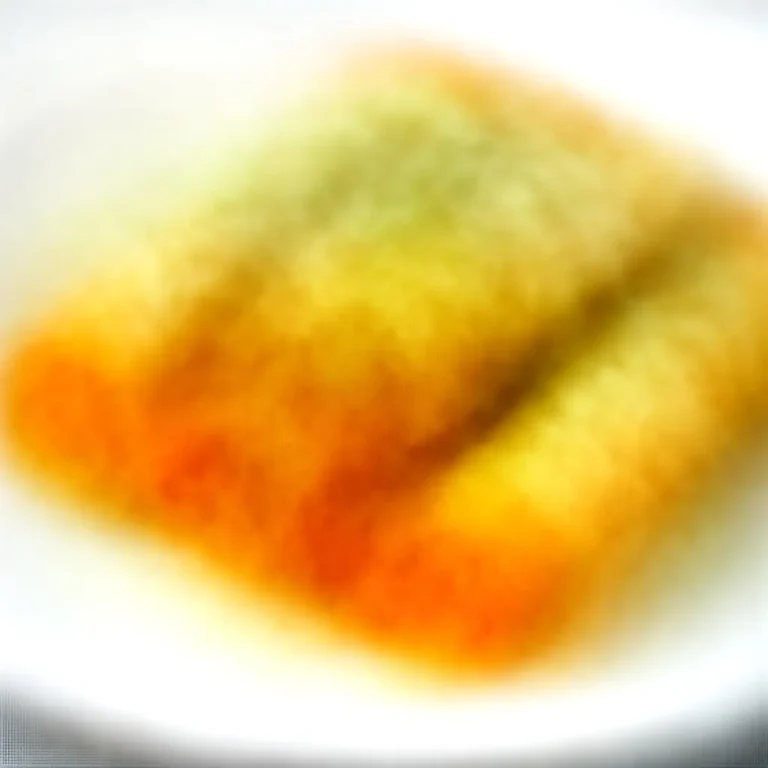 Oven-Baked Buffalo Chicken Taquitos with Avocado Crema